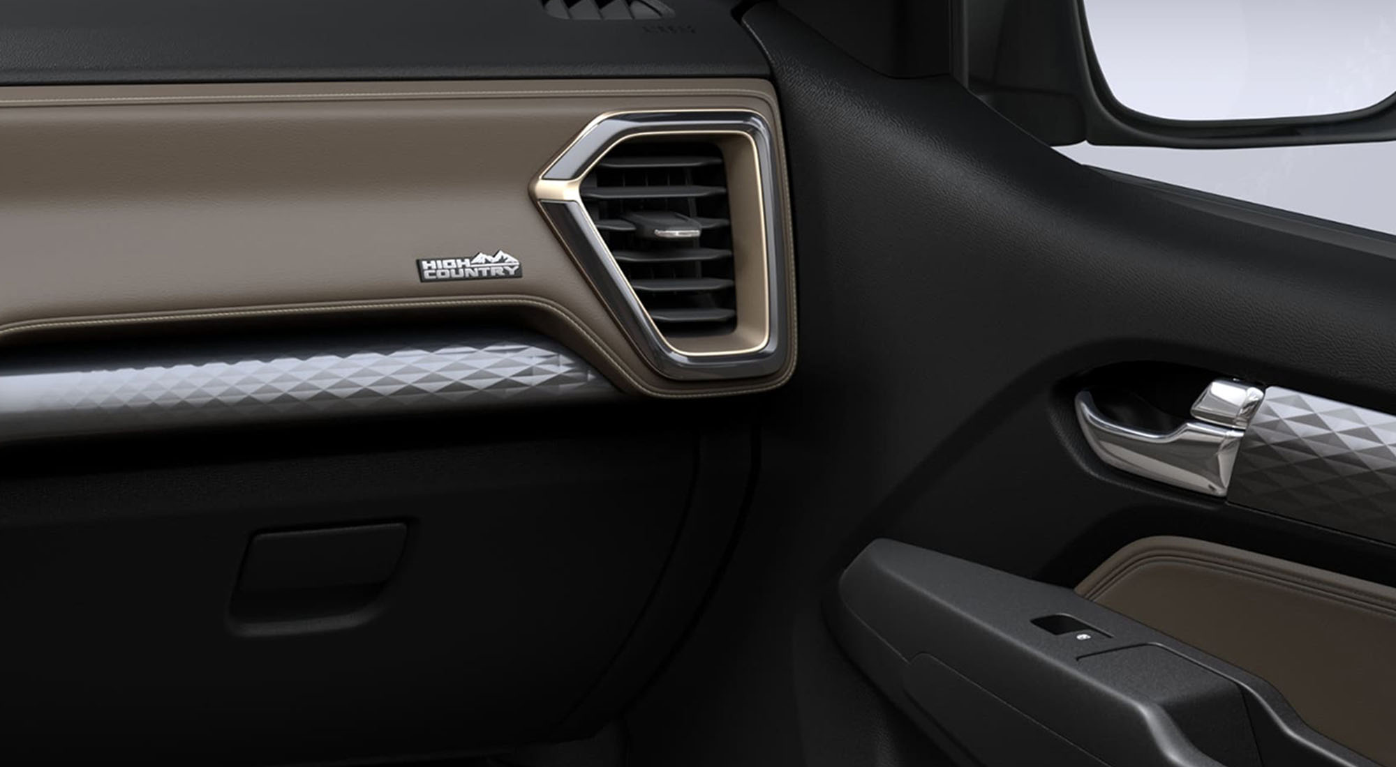 Detalle interior de la puerta derecha de la Chevrolet Colorado con salida de aire y controles eléctricos